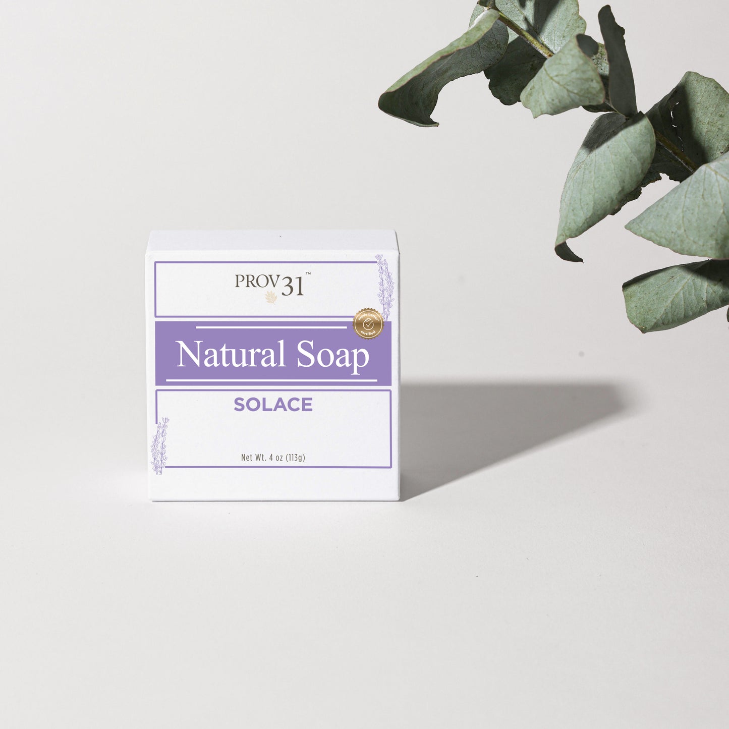 Bar of natural lavender soap with 'PROV 31' packaging on a white background with a plant
