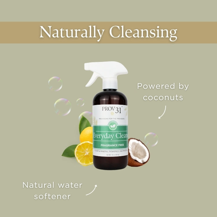Bottle of Prov 31 Everyday Cleaner with lemon, coconut, and soap bubbles on a green background