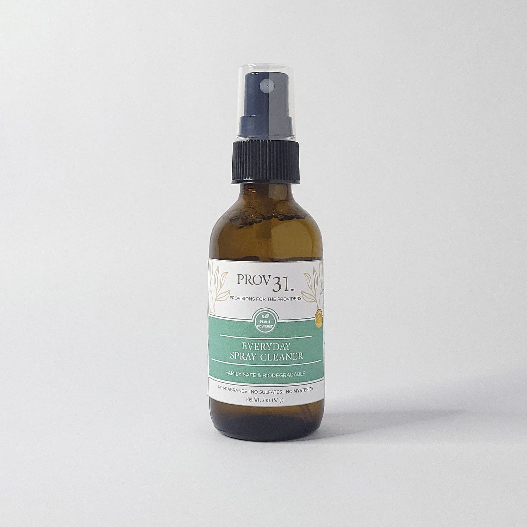 Glass bottle of Prov 31 Everyday Spray Cleaner on a white background